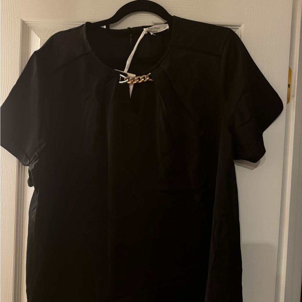 Black dressy top with gold chain closure in front